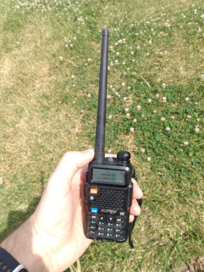 Picture of a hand held radio tuned to the W4AVA repeater